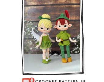 May include: Two handmade crochet dolls, a fairy and Peter Pan, stand side-by-side. The fairy wears a green dress and has white wings. Peter Pan is dressed in green with a red feather in his hat. The image includes the text "CROCHET PATTERN IN ENGLISH."