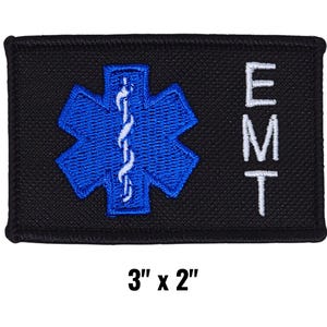 May include: Black rectangular patch with a blue Star of Life emblem and the letters "EMT" in white. The patch measures 3 inches by 2 inches.