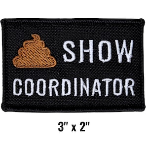 May include: Black rectangular patch with embroidered text and a brown poop emoji. The text reads "SHOW COORDINATOR" in white thread. The patch measures 3 inches by 2 inches.