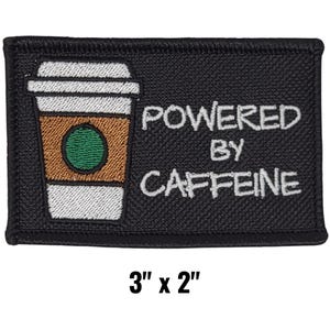 May include: Black rectangular patch with the text "POWERED BY CAFFEINE" in white. A coffee cup graphic is on the left side. The patch measures 3 inches by 2 inches.