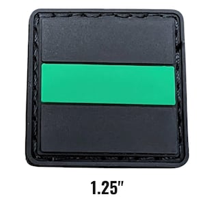 May include: A square black patch with a bright green horizontal stripe across the center. The patch is 1.25 inches wide and has a stitched border. The text "1.25" is printed in black at the bottom.