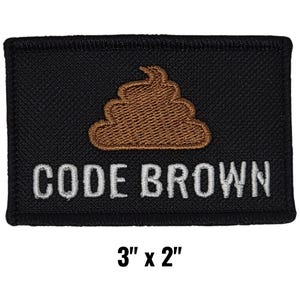 May include: Black rectangular patch with the words "CODE BROWN" in white lettering. A brown poop emoji is embroidered above the text. The patch measures 3 inches by 2 inches.