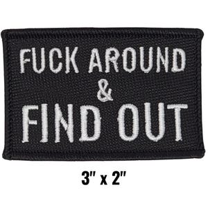 May include: Black rectangular patch with white embroidered text that reads "FUCK AROUND & FIND OUT." The patch measures 3 inches by 2 inches.