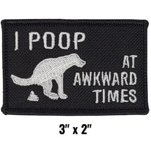 May include: Black rectangular patch with white text and a dog graphic. The text reads "I POOP AT AWKWARD TIMES." The patch measures 3" x 2".