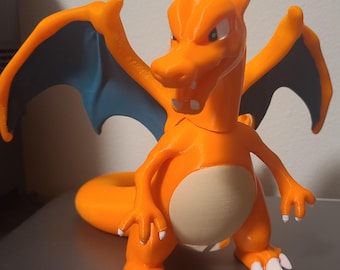May include: Orange and blue 3D printed figurine of a dragon with wings, claws, and a tail.