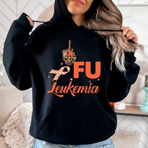 May include: Black hoodie with a graphic of a middle finger with an orange ribbon and the text "FU Leukemia".