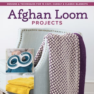May include: A book titled "Afghan Loom Projects: Designs & Techniques for 15 Cozy, Cuddly & Classic Blankets" with a purple and white knitted blanket draped over a chair. The book cover features a close-up of the blanket and a loom.