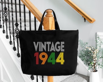 May include: Black canvas tote bag with the text "Vintage 1944" in a retro font. The numbers are outlined in red, green, and yellow.