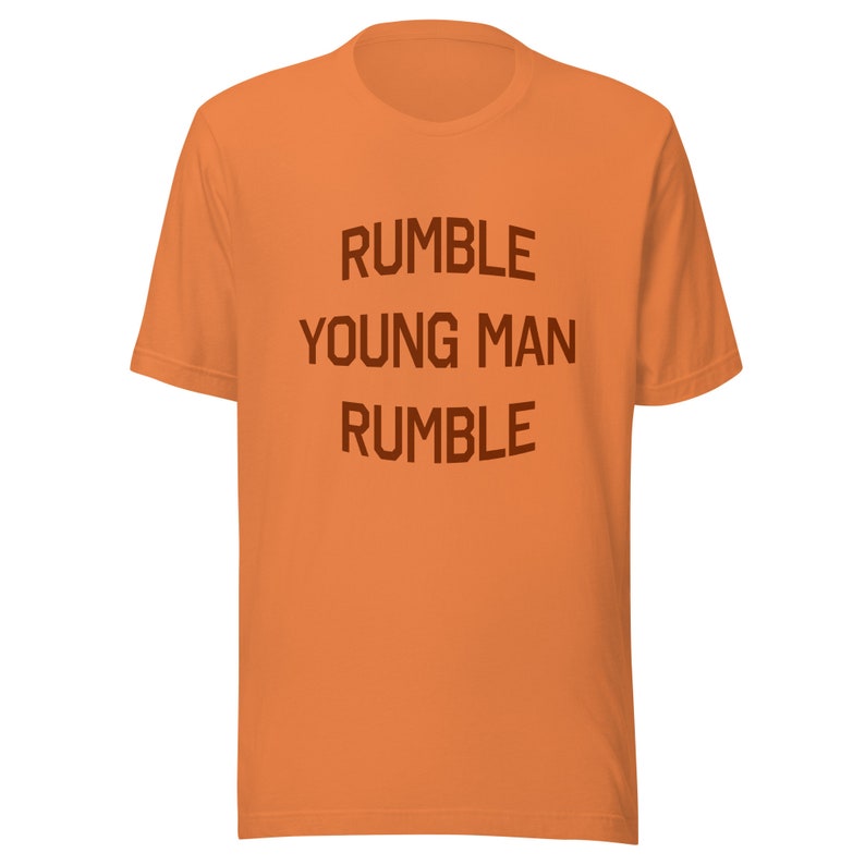 Rumble Young Man Rumble Muhammad Aliinspired Unisex Tshirt Brown Text