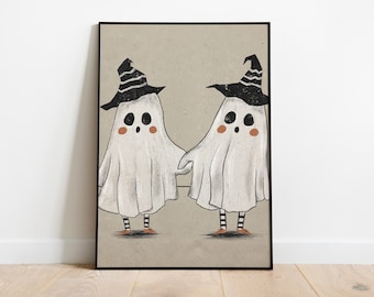 May include: Two white ghosts with black and white striped witch hats and orange shoes are holding hands. The ghosts have black eyes and orange cheeks. The background is a light brown.