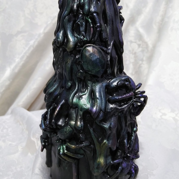 black "Modelo bottle" covered in spiders. there is powdered colors to add spice to this unique piece of art!