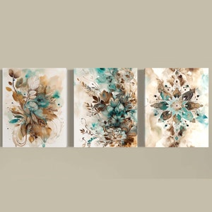 May include: Set of three abstract floral canvas wall art prints. The prints feature a watercolour style with teal and brown colours.
