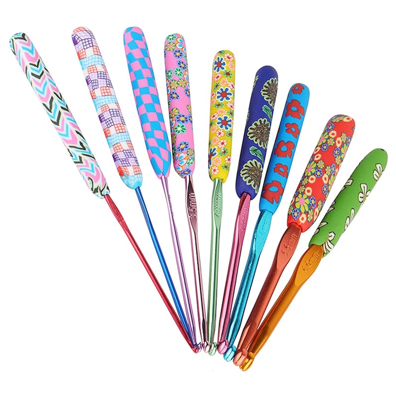 May include: Set of 10 colourful crochet hooks with different patterned handles. The hooks are made of metal and have a variety of sizes.