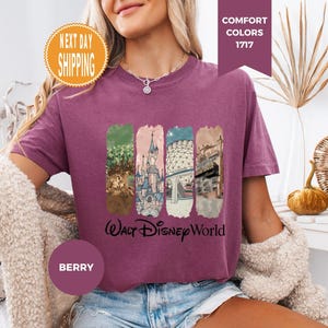 May include: A white ceramic mug with a black handle and the text "But First, Coffee" in a bold, black font. The mug is set against a blurred background, suggesting a cozy setting.