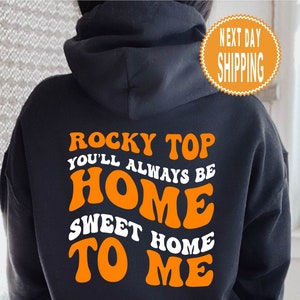 May include: Black hoodie with orange text that reads "Rocky Top You'll Always Be Home Sweet Home To Me".
