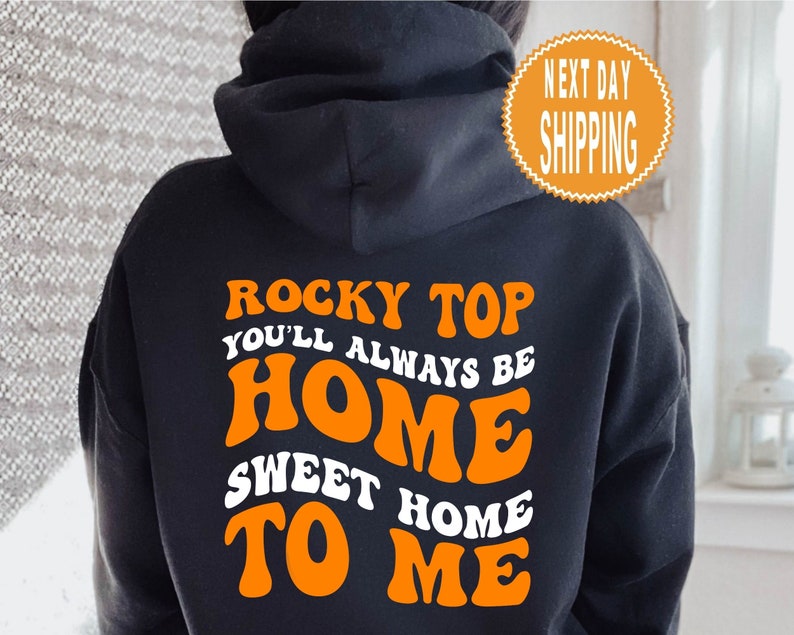 May include: Black hoodie with orange text that reads "Rocky Top You'll Always Be Home Sweet Home To Me".