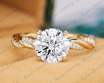 May include: A gold ring featuring a large, round, brilliant-cut center stone held by four prongs. The band has a twisted design with small, clear, round-cut stones embedded along the sides of the shank, creating a sparkling, textured appearance.