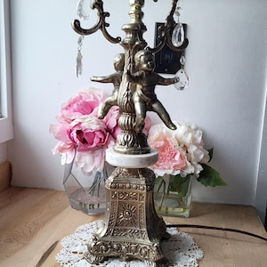 Vintage Hollywood Regency, Metal Table Lamp with Cherubs or Putti Sitting on a Round Base of Marble