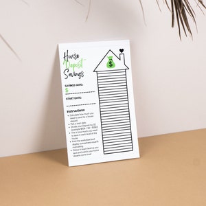 May include: A printable house deposit savings tracker featuring a black and white house illustration. The tracker includes instructions to calculate how much to save for a house deposit, choose a start date, and divide the deposit by 32. The tracker also includes a space to write in the savings goal and start date.