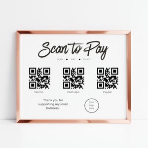 May include: A framed sign with a rose gold border and a white background. The sign reads "Scan to Pay" in a stylish font, with QR codes for Venmo, Cash App, and Paypal. The text "Thank you for supporting my small business!" is also included.