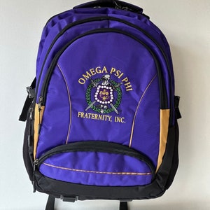 Omega Psi Phi (ΩΨΦ) Fraternity, Purple & gold Stylish, Polyester Fabric Coated College Backpack with laptop sleeves For Men, Made in India.