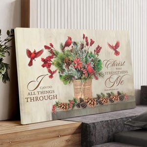 May include: Canvas art print featuring a floral arrangement with red cardinals, berries, and pinecones. The artwork includes the text "I can do all things through Christ who strengthens me" from Philippians 4:13.