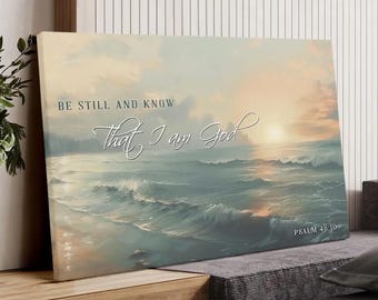May include: A canvas print depicting a seascape with a sunset. The artwork features ocean waves and a sky with warm colors. The text "BE STILL AND KNOW That I am God" is displayed in elegant script, with "PSALM 46:10" at the bottom.