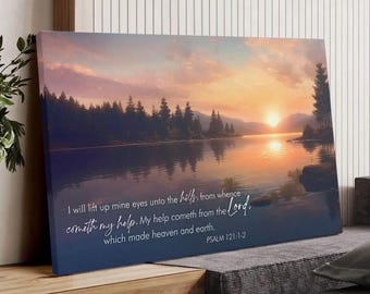 May include: A canvas print depicting a serene lake scene at sunset. The artwork features a vibrant sky with orange and yellow hues reflecting on the water. Text from Psalm 121:1-2 is inscribed on the canvas, adding a spiritual element.