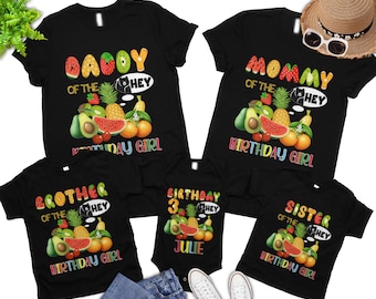 May include: A set of five black t-shirts with colorful fruit graphics and text that reads "Daddy of the Birthday Girl", "Mommy of the Birthday Girl", "Brother of the Birthday Girl", "Birthday 3 Julie", and "Sister of the Birthday Girl".