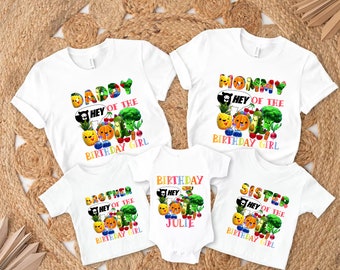 May include: Set of five white t-shirts with colorful fruit and vegetable graphics and text that reads "Daddy of the Birthday Girl", "Mommy of the Birthday Girl", "Brother of the Birthday Girl", "Sister of the Birthday Girl", and "Birthday Julie".