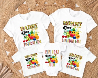 May include: Set of five white t-shirts with colorful fruit graphics and the text "Daddy of the Birthday Girl", "Mommy of the Birthday Girl", "Brother of the Birthday Girl", "Sister of the Birthday Girl", and "Birthday Girl Julie".
