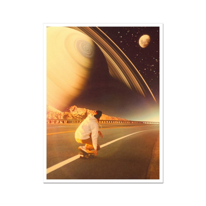 May include: A person on a skateboard rides down a road with a mountain range in the background. The sky is filled with stars and a large planet with rings.