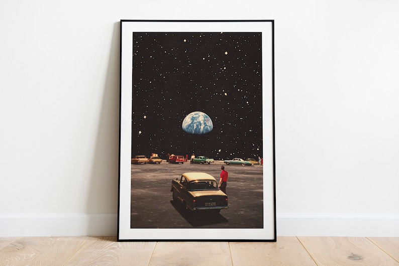 May include: A vintage car drives on a deserted road with a view of Earth in the night sky. The car is a light brown color with a black roof and a man in a red shirt is standing next to it. The sky is dark blue with white stars and a bright blue planet.