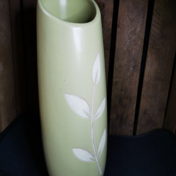 Tall green vase with flower design, pretty shape