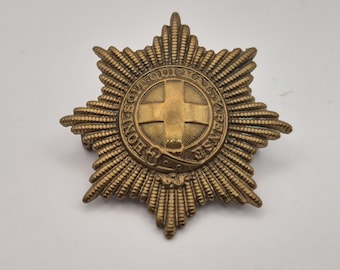 Insignia de gorra vintage del ejército británico de la Segunda Guerra Mundial, Cuerpo de Servicios Generales (GSC), de latón con asas.
