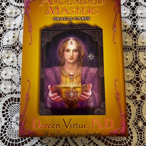 Doreen Virtue "Ascended Masters Oracle Deck" including guide book.  Out of Print - Rare. In very good preloved condition. One owner. Vintage