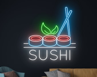 May include: Neon sign featuring a sushi roll design and the word "SUSHI" in white. The sushi rolls are outlined in blue and have red centres. The sign is against a dark blue background.