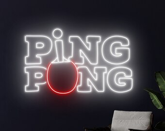 May include: White neon sign with the words "PING PONG" in a bold font. A red neon circle is in the middle of the sign, representing a ping pong ball.