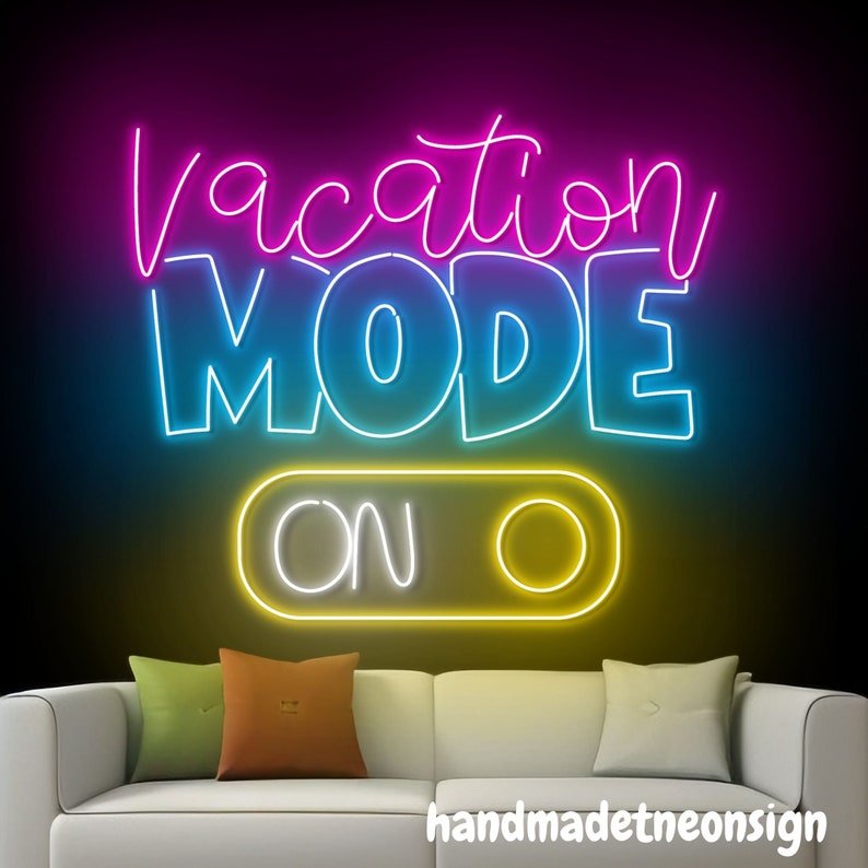 May include: Neon sign with the text "Vacation Mode On" in a white outline with a yellow, blue, and pink background. The sign is on a dark background and is lit up.