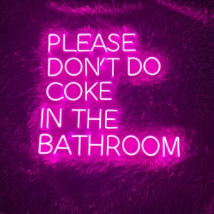 May include: Pink neon sign with the text "PLEASE DON'T DO COKE IN THE BATHROOM".