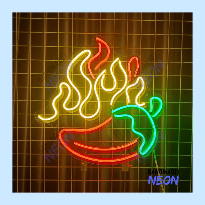 May include: A neon sign in the shape of a chili pepper with flames. The chili pepper is red and green, with yellow flames. The sign is on a yellow grid background. The text "HANDMADE NEON" is at the bottom.