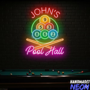 May include: Neon sign for a pool hall with the text "JOHN'S" in red, a green circle with pool balls numbered 9, 5, 3, 8, 6, and 2, and the words "Pool Hall" in pink. Two crossed pool cues are below the balls.