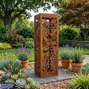May include: A tall, rectangular, rusted metal garden sculpture with cut-out designs of bees, honeycomb, and plants. The sculpture stands on a stone surface, surrounded by potted plants in a garden. The design is a decorative outdoor feature.