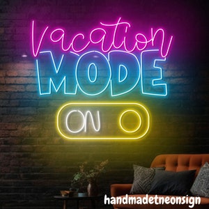 May include: Neon sign with the text "Vacation Mode On" in pink, blue, and yellow. The sign is on a brick wall background.