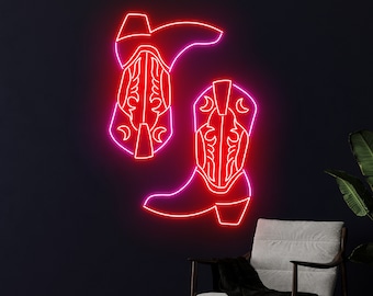 May include: Neon sign depicting two cowboy boots in a pink and red color scheme. The boots are outlined in neon and have a western design.