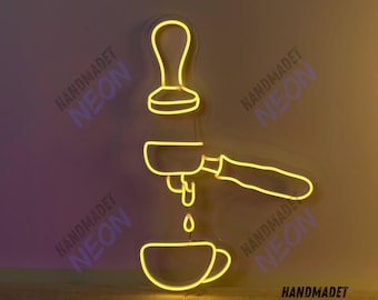 May include: Yellow neon sign depicting a coffee maker pouring coffee into a cup. The sign reads "HANDMADET NEON" in the bottom right corner.