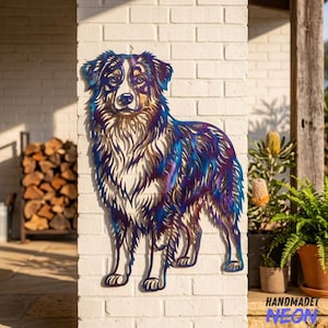 May include: A metal wall art piece shaped like an Australian Shepherd dog, featuring a heat-treated finish with iridescent blue, purple, and bronze tones. The cutout design highlights the dog's fur texture, pointed ears, and alert facial expression.