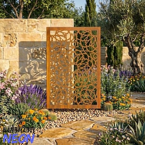 May include: A rectangular, rust-coloured metal garden screen featuring a cut-out branch design. The screen is positioned in a garden with diverse plants, including lavender, cacti, and yellow flowers. The word "HANDMADE NEON" is at the bottom.