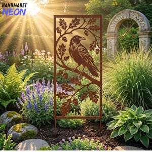 May include: A rectangular metal garden screen featuring a laser-cut design of a raven perched on an oak branch with leaves and acorns. The panel has a rusted brown finish and is positioned vertically, showcasing intricate cutouts of the bird.