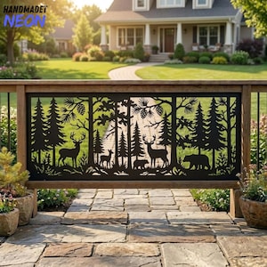 May include: A black metal decorative railing panel featuring a laser-cut forest scene with pine trees, a deer, a fawn, and a bear. The design includes intricate silhouettes of woodland animals and coniferous trees set against a clear outdoor view.